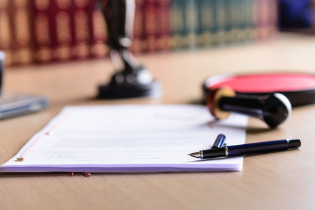 legal documents and a pen
